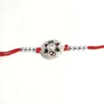 Silver flower rakhi