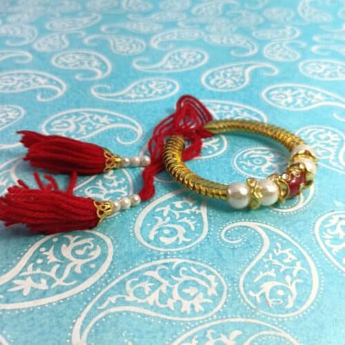 Kundan and white Pearls metal Lumba Rakhi